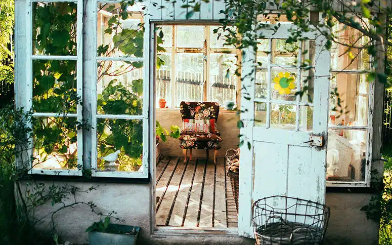 Outside view of a solarium with an open door.
